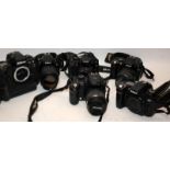 A collection of Digital SLR cameras to include Nikon and Canon examples. All offered untested