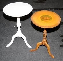 Two vintage wine tables on pedestal bases, one being a tilt top.