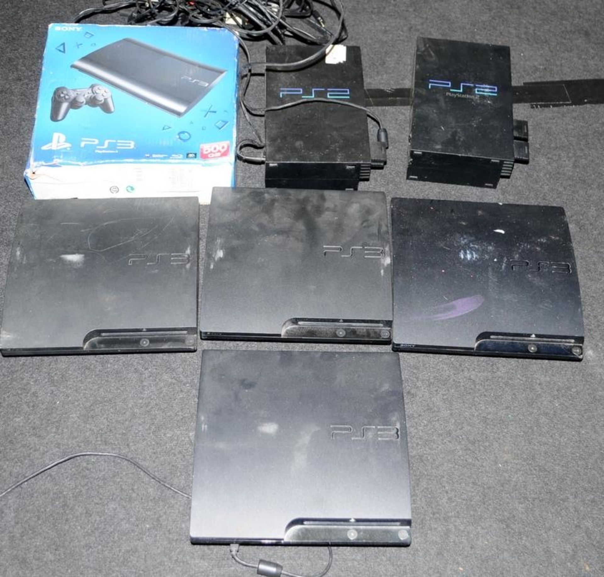 A carton of Playstation 2 and Playstation 3's