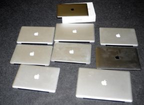 A quantity of Apple MacBooks, no cables, untested