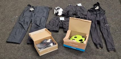 A quantity of new cycling clothes to include helmet and shoes. (unworn)