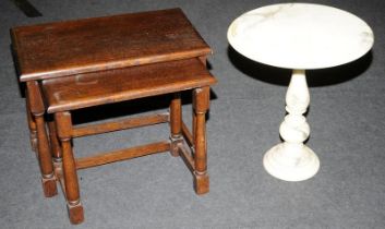 Nest of two oak stained mahogany occasional tables together with a small composite table.