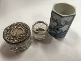 Silver lidded cut glass dressing table pot, a silver and glass napkin ring and a Chinese small pot
