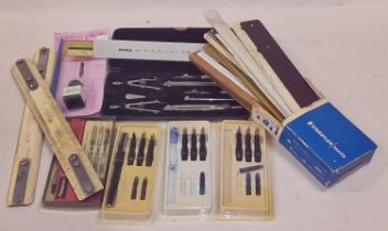 Boxed draughtsman drawing tools with a collection of calligraphy items