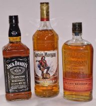 Three bottles of alcohol: Jack Daniel's Tennessee Whiskey, Captain Morgan Original Spiced Gold rum