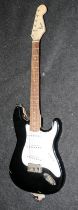 Fender Squire Stratocaster electric guitar, black body with white scratch plate c/w carry bag.