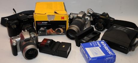 A collection of vintage 35mm film SLR Cameras to include Nikon and Canon c/w other photographic