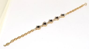 A sapphire/diamond gold on 925 silver bracelet.