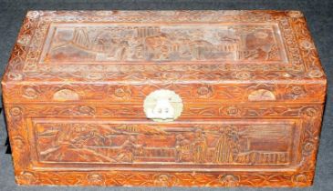 A heavily carved camphor wood storage trunk 88x42x38cm.