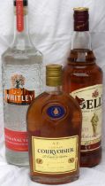 1Ltr Bells Whisky, 1ltr Artisans Vodka, and bottle Courvoisier