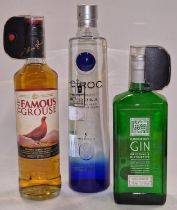 Three bottles of alcohol: Ciroc Snap Frost Vodka, The Famous Grouse Whiskey and London Dry Gin (