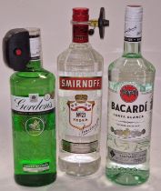 Three bottles of alcohol: Smirnoff Vodka, Bacardi and Gordon's Gin (REF 19, 20, 56).