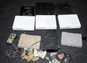 A collection of games consoles to include X-Box and Playstation models