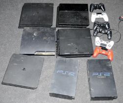 A collection of Playstation 2, 3 and 4's and controllers