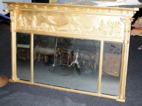 Gilt over-mantle mirror of three sections with a panel depicting classical scene. Original