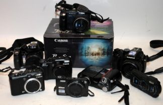 A collection of digital compact cameras to include Canon, Nikon etc