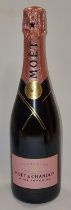 Moet & Chandon sealed bottle of Rose Imperial champagne.