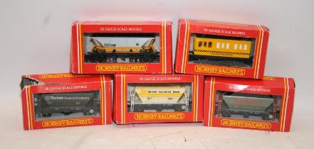 Hornby OO gauge rolling stock. 4 x goods wagons and a track cleaning coach. All boxed (boxes tatty)