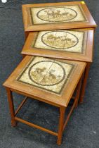 Nest of three vintage teak occasional tables each with tiled top depicting deers. The largest