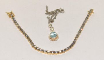 A Blue Topaz 925 silver line bracelet and pendant.