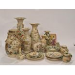 Large quantity of Oriental Satsuma pottery pieces to include vases and plates.