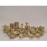 Large quantity of Oriental Satsuma pottery pieces to include vases, cups and saucers.