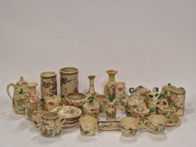 Large quantity of Oriental Satsuma pottery pieces to include vases, cups and saucers.