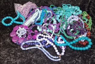 Large quantity of beaded necklaces and bracelets to include Malachite, Jadeite, and Tourquoise