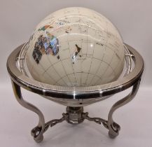 Large contemporary gem set rotating globe of the world.