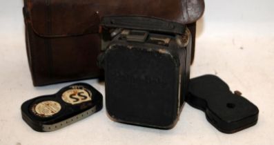 Baby Pathe Cine Camera in original leather case c/w 2 film reels