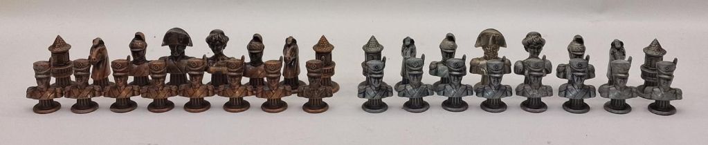 Full set of cast metal military themed chess pieces.