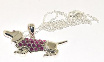 Silver dog pendant necklace with a Ruby coat