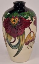 Moorcroft vase in the "Anna Lily" pattern signed and stamped to base 24cm tall.