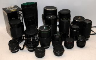 A collection of vintage SLR camera lenses to include Canon examples