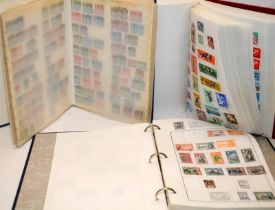 Album of world stamps c/w 2 well filled world stamps stock books