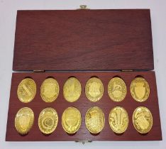 Boxed silver hallmarked set of 12 medals "The Arms of the Prince and Princess of Wales" 169g