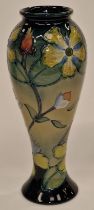 Moorcroft tall vase in the Hypericum pattern 1993 signed and stamped to base 28cm tall.