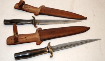 Two similar Indian horn handled sheath knives. Blade length 19cms, o/all length 32cms