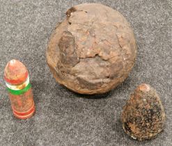Local divers find off of Poole Harbour area large 21 pound cannon ball together with two shells.