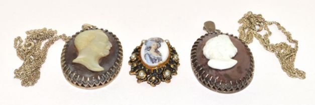 2 x Cameo pendants both on silver chains together with a similar pendant