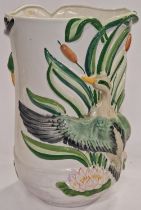 A large vintage porcelain vase decorated with birds and plants 43cm tall.