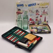 Mixed lot to include two glass cod neck bottles, pottery fish, backgammon set and a comic strip