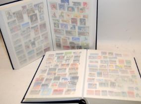 2 good quality stock books well filled with world stamps