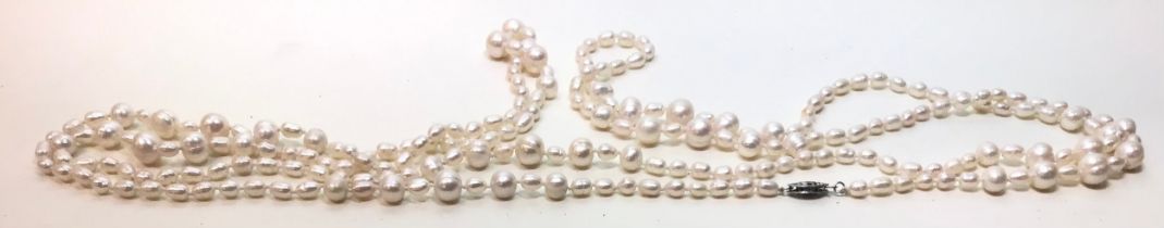 Long cultured pearl white metal necklace.