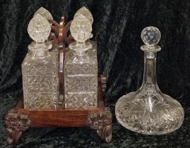 Crystal glassware four decanter stand together with a crystal glass ships decanter.