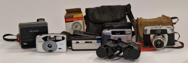 Collection of six vintage compact film cameras together with a pair of cased Halina Discovery