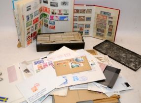 A collection of ephemera to include a small world stamps stock book, a tin of Tea and Cigarette