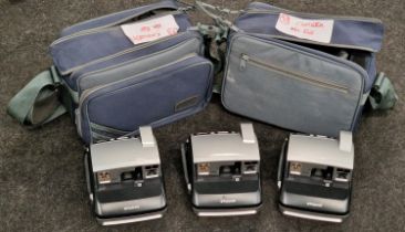 Three Polaroid One 600 instant cameras with two cases (REF 38).