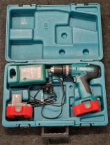 Makita cordless hammer driver drill with batteries cased (REF 43).