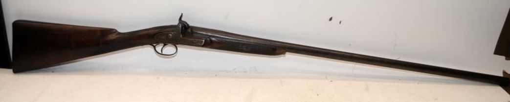 Antique muzzle loading percussion rifle. Muzzle separates from stock. Mechanism cocks and